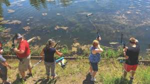 Kids learning bowfishing