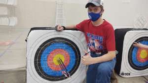 Masked kid with target